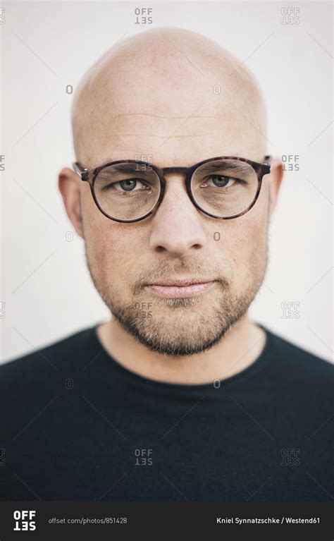 handsome bald with glasses.